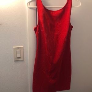 Red open back dress with bow